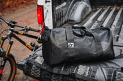 High Above Lost Lake Duffel Bag In bed of pickup truck.