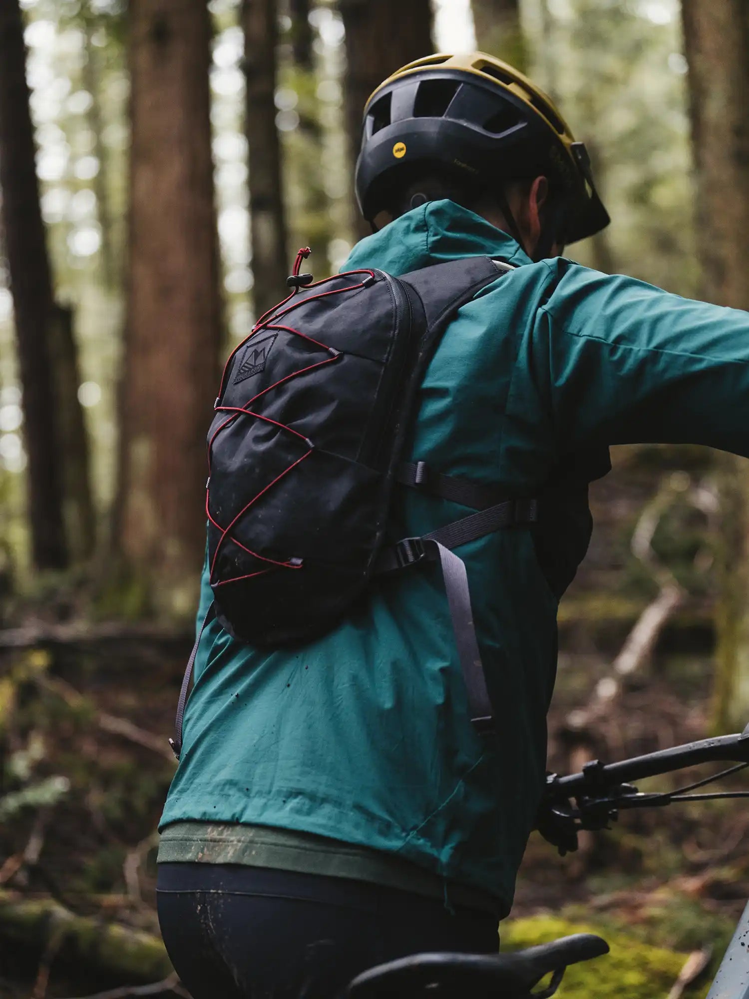 Mountain bike rider wearing High Above Supernatural Vest Pack