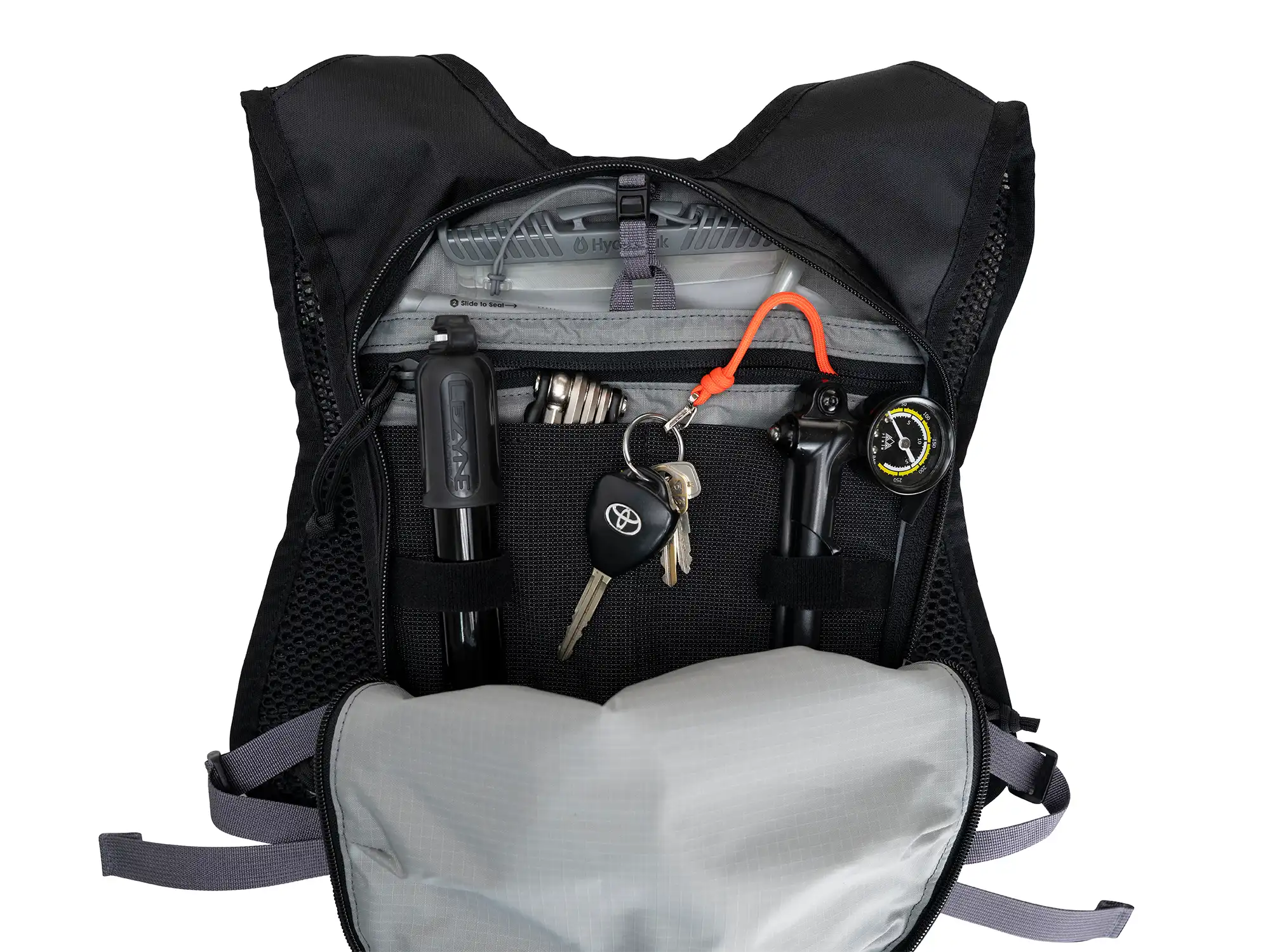Interior of High Above Supernatural Hydration Vest Pack showing pump storage, key clip , and tool pockets.