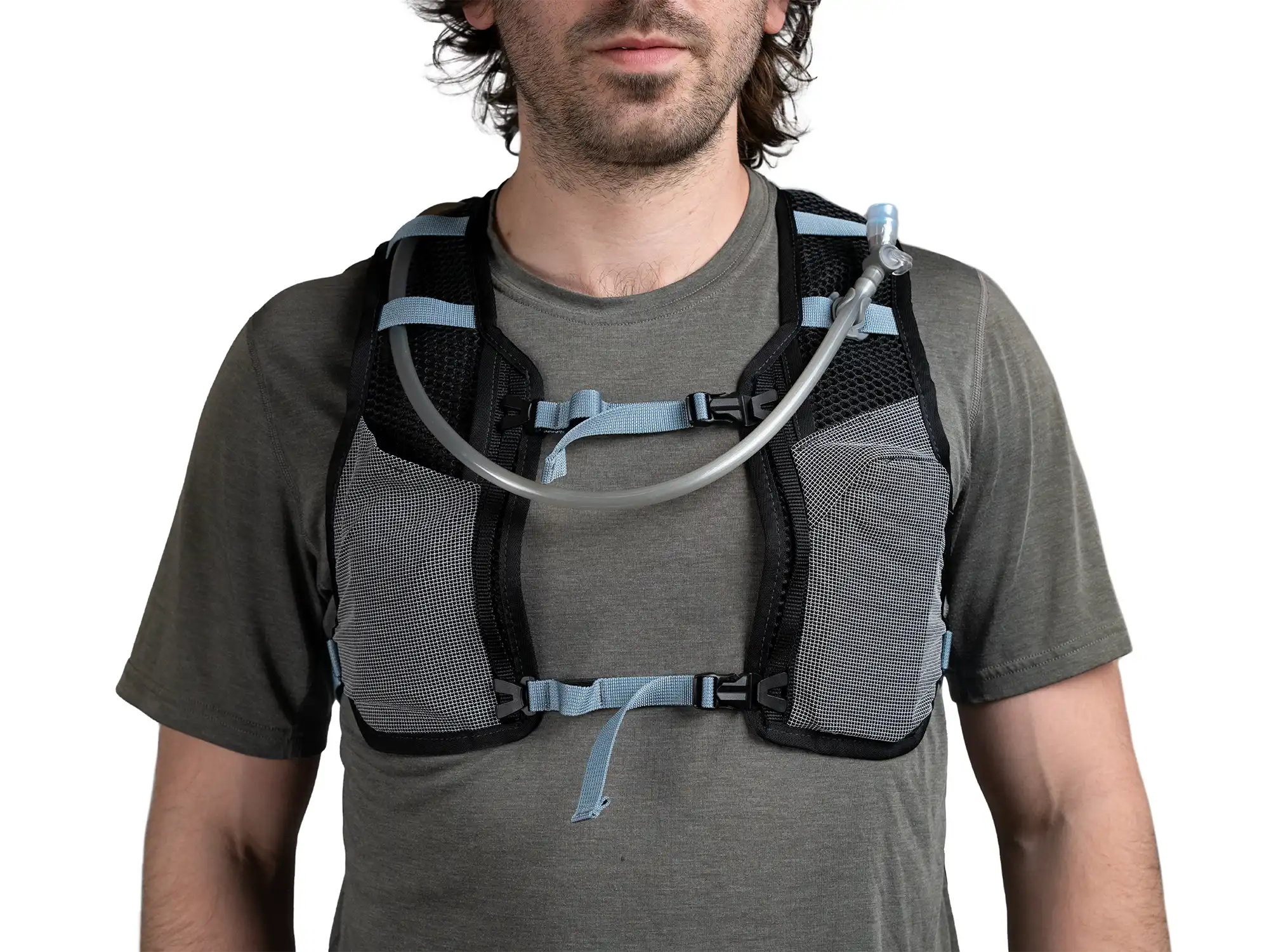 Close up front view of person wearing High Above Supernatural Hydration Vest Pack