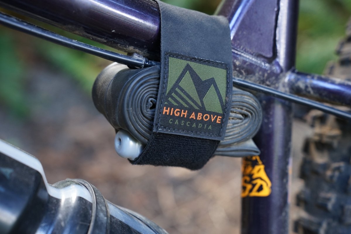 High Above Dark Matter Tube Strap with tube mounted on bike.