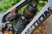 High Above 26 oz Water Bottle in bottle cage on mountain bike.