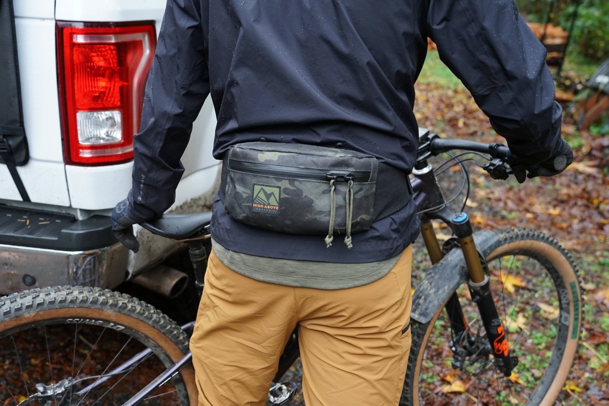Mountain biker wearing High Above Rad Pack Hip Pack in Camo