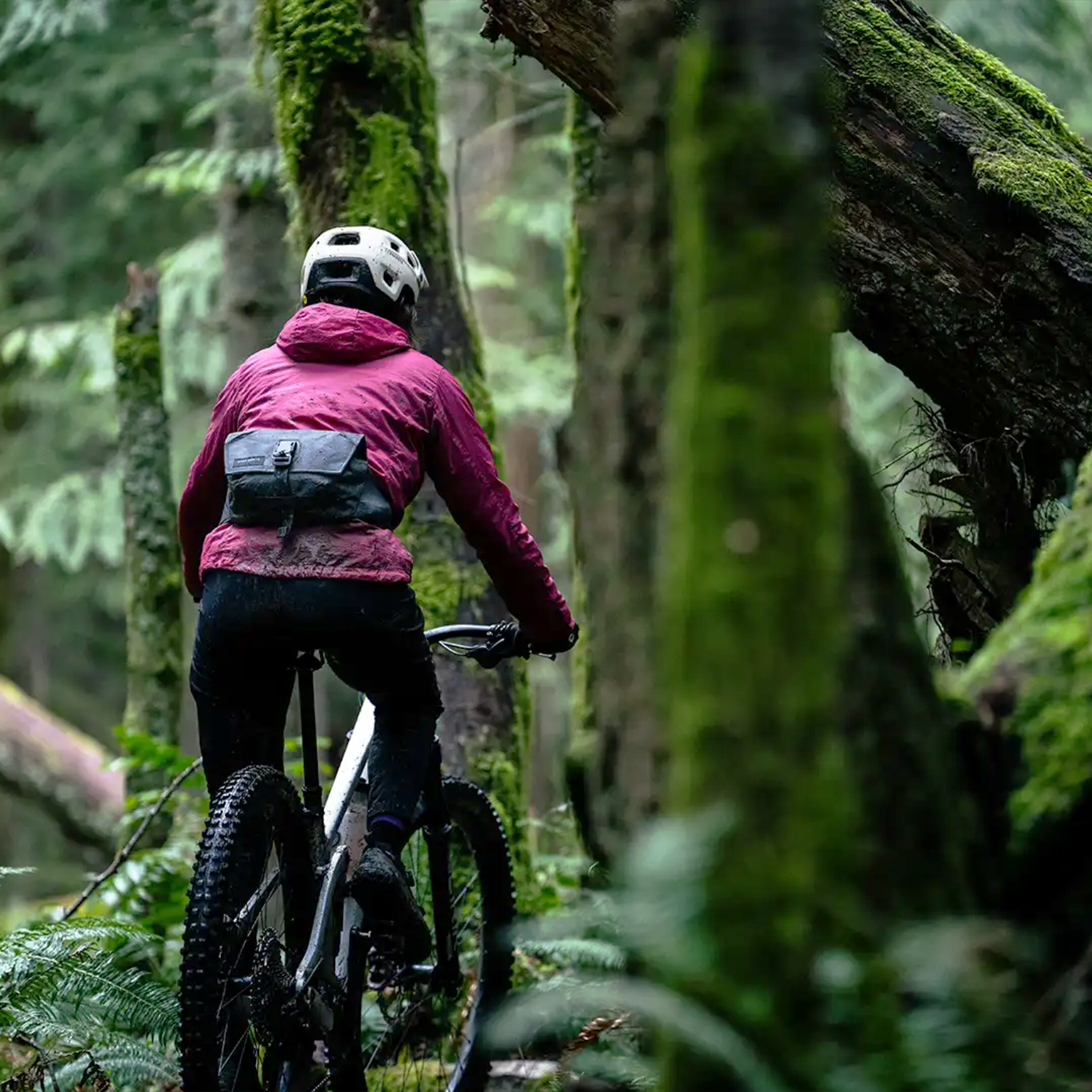 High Above Venture 3D Hip Pack Three Quarter View from back of someone riding in the mud